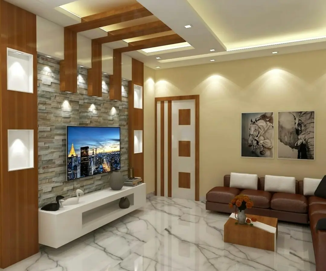 Living room with a wall-mounted TV above a white unit and a brown leather sofa